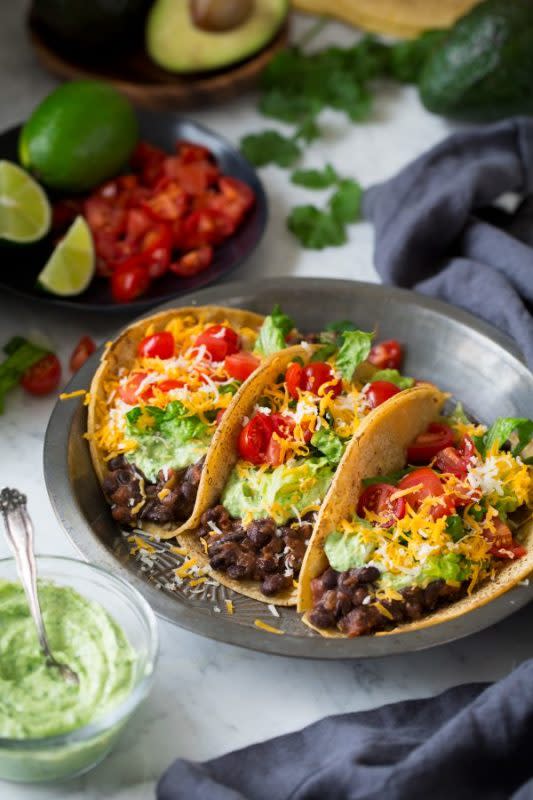 <p>Cooking Classy</p><p>These tacos are a little healthier, and the filling only takes five minutes to make! </p><p><strong>Cost: $15.78</strong></p><p><strong>Get the recipe: <a href="https://www.cookingclassy.com/black-bean-tacos-with-avocado-cilantro-lime-crema/" rel="nofollow noopener" target="_blank" data-ylk="slk:Black Bean Tacos;elm:context_link;itc:0;sec:content-canvas" class="link ">Black Bean Tacos</a></strong></p>