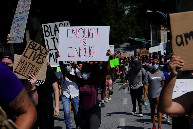 Protesters rally against racial inequality and the police shooting death of Rayshard Brooks, in Atlanta