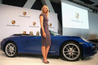 STUTTGART, GERMANY - APRIL 22: Tennis player Maria Sharapova poses for the media next to a Porsche 911 Carrera 4 Cabriolet as she is unveiled as car manufacturer Porsche's new brand ambassador at the Porsche Museum on April 22, 2013 in Stuttgart, Germany. (Photo by Alexander Hassenstein/Bongarts/Getty Images)