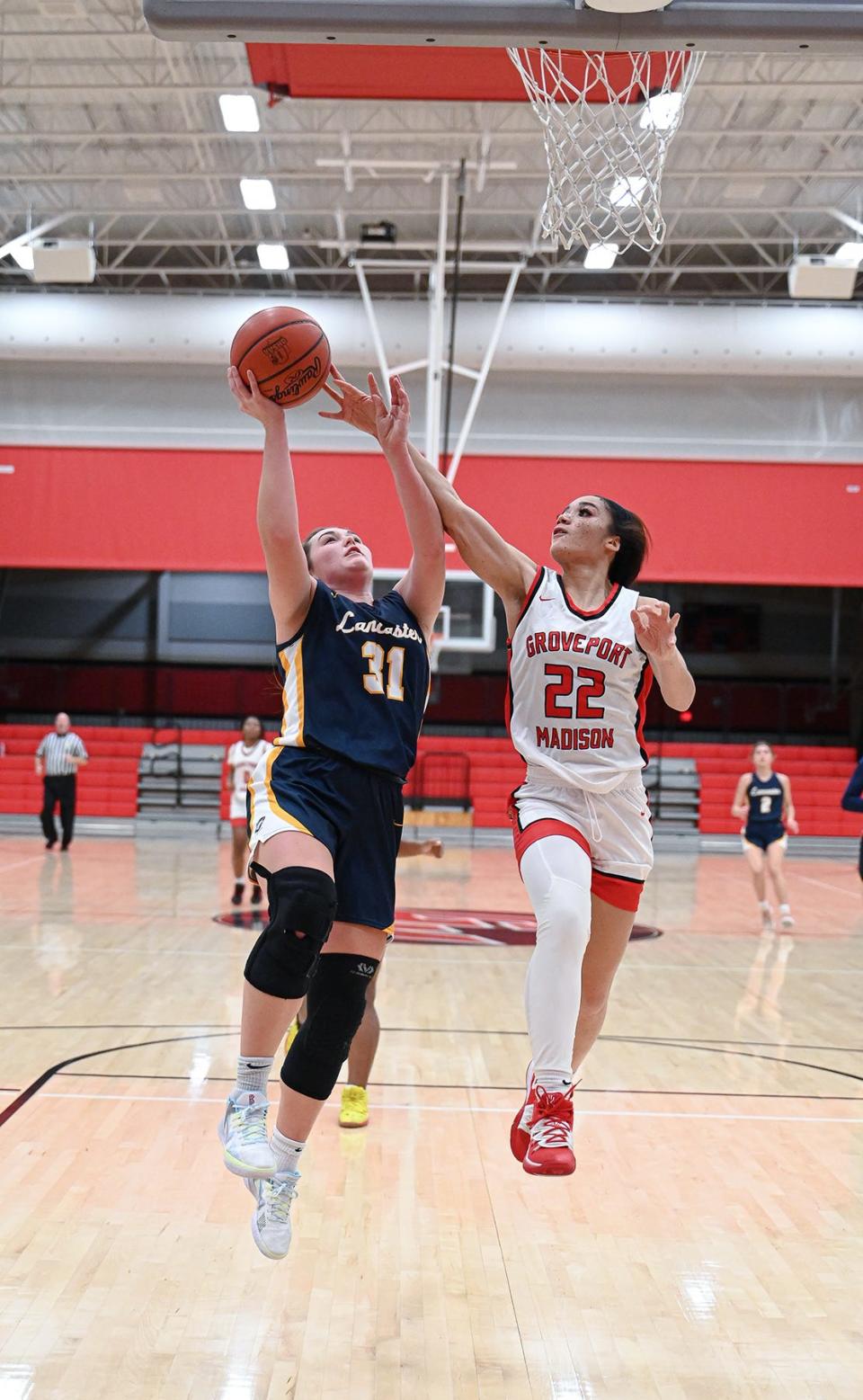 Lancaster's Peyton Wilson shoots a lay up Friday night at Groveport Madison High School. The Lady Gales lost 65-64 in overtime.