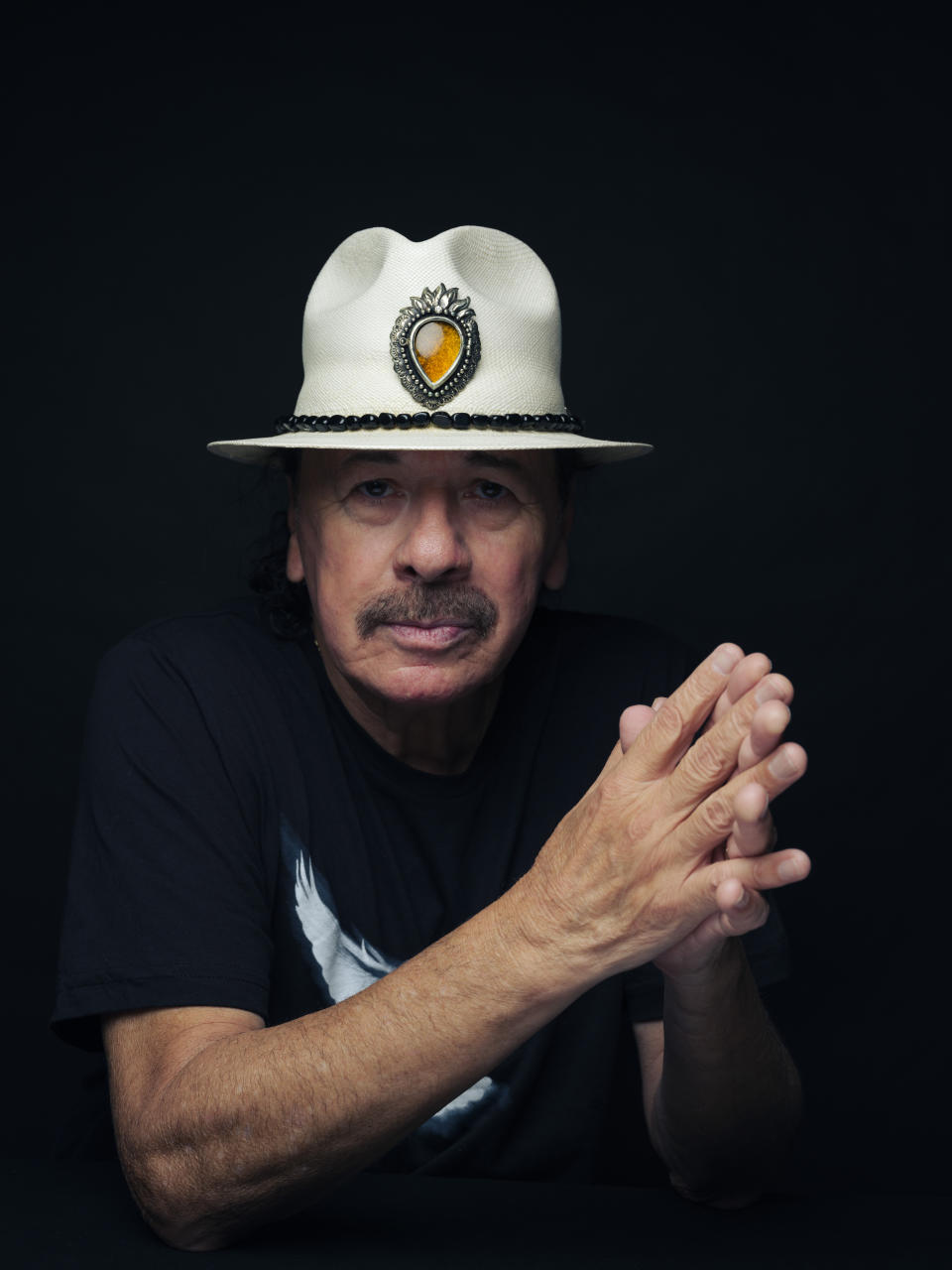 Carlos Santana poses for a portrait on Friday, June 16, 2023, in New York. (Photo by Drew Gurian/Invision/AP)