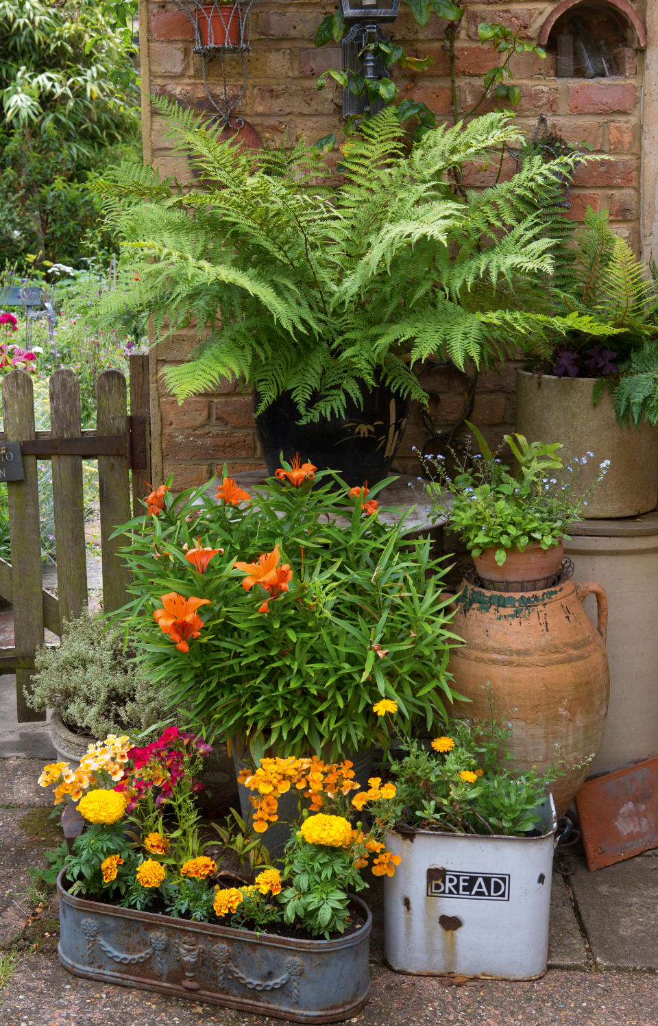 16. Make DIY alternative planters from old kitchenware