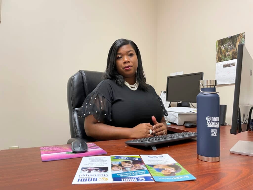 Sitaniel Wimbley poses for a photo at her office, the headquarters for NAMI Mississippi in Ridgeland, Miss., on July 11, 2022. Wimbley is working to strengthen connections between mental health programs and people skeptical of their services. (AP Photo/Michael Goldberg)