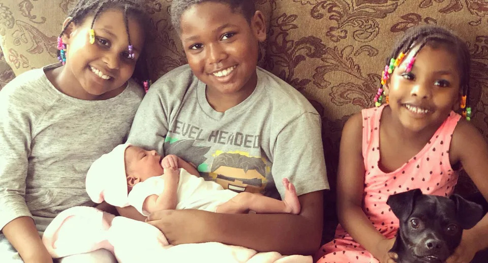 The proud siblings including Jayden (middle) hold baby Jolee.