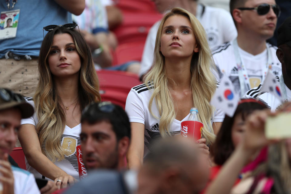 <p>Matthias Ginter of Germany’s wife, Christina Ginter, and Marco Reus of Germany’s girlfriend Scarlett Gartmann look on during the 2018 FIFA World Cup Russia group F match between Korea Republic and Germany at Kazan Arena on June 27, 2018 in Kazan, Russia. (Photo by Lars Baron – FIFA/FIFA via Getty Images) </p>