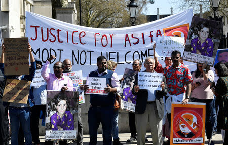 Demonstrators stage a protest against the visit by India's Prime Minister Narendra Modi opposite Downing Street in London, Britain, April 18, 2018. REUTERS/Toby Melville