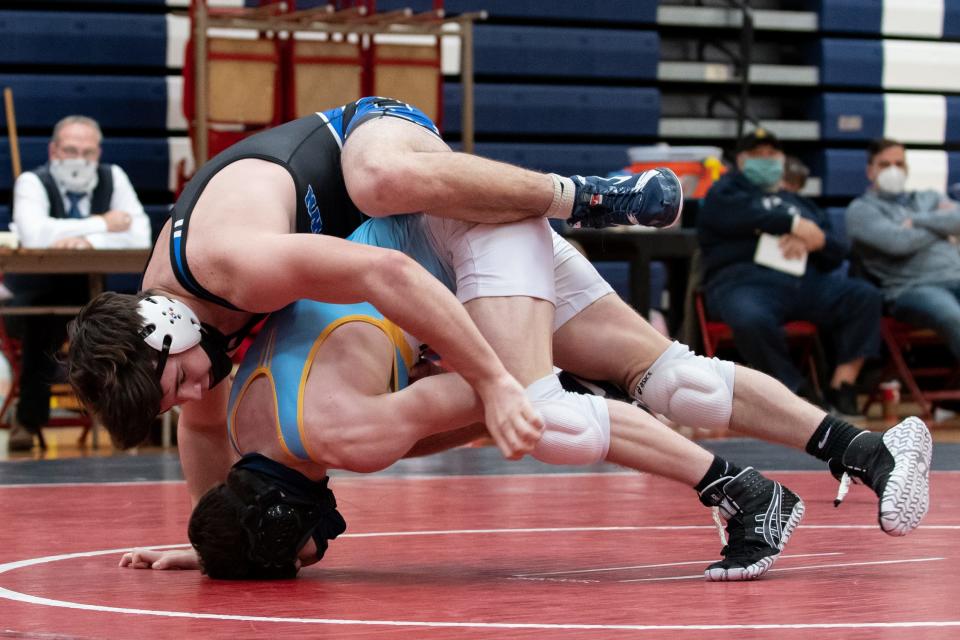 Quakertown's Kaden Roesener, top, wrestles Council Rock South's Matt Colajezzi in a 189-pound match during a Suburban One League quad meet at Central Bucks East High School in Buckingham on Saturday, February 6, 2021. The Golden Hawks defeated the Panthers, 39-27.