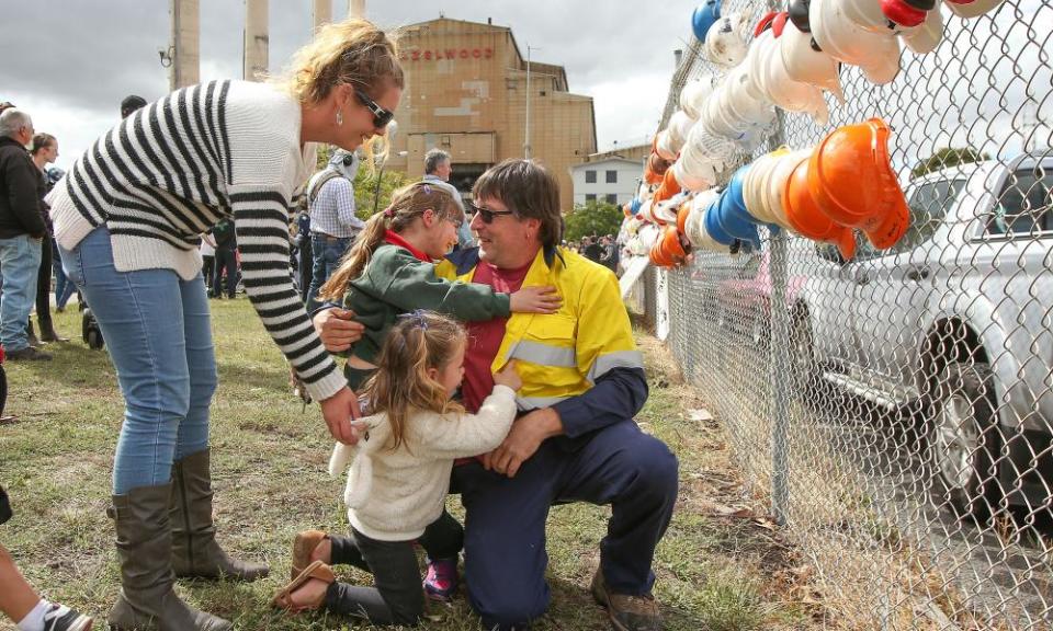 Robb Ortel is embraced by his family after finishing his last shift at Hazelwood power station on Friday.