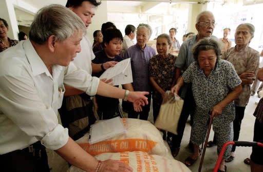 PM Lee talks about the role of CDCs. (AFP file photo)