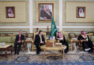 U.S. Secretary of State Mike Pompeo, centre left, talks with Saudi Foreign Minister Adel al-Jubeir, after arriving in Riyadh, Saudi Arabia, Tuesday Oct. 16, 2018. Pompeo arrived Tuesday in Saudi Arabia for high level diplomatic talks over the unexplained disappearance and alleged slaying of Saudi writer Jamal Khashoggi, who vanished two weeks ago during a visit to the Saudi Consulate in Istanbul. (Leah Millis/Pool via AP)