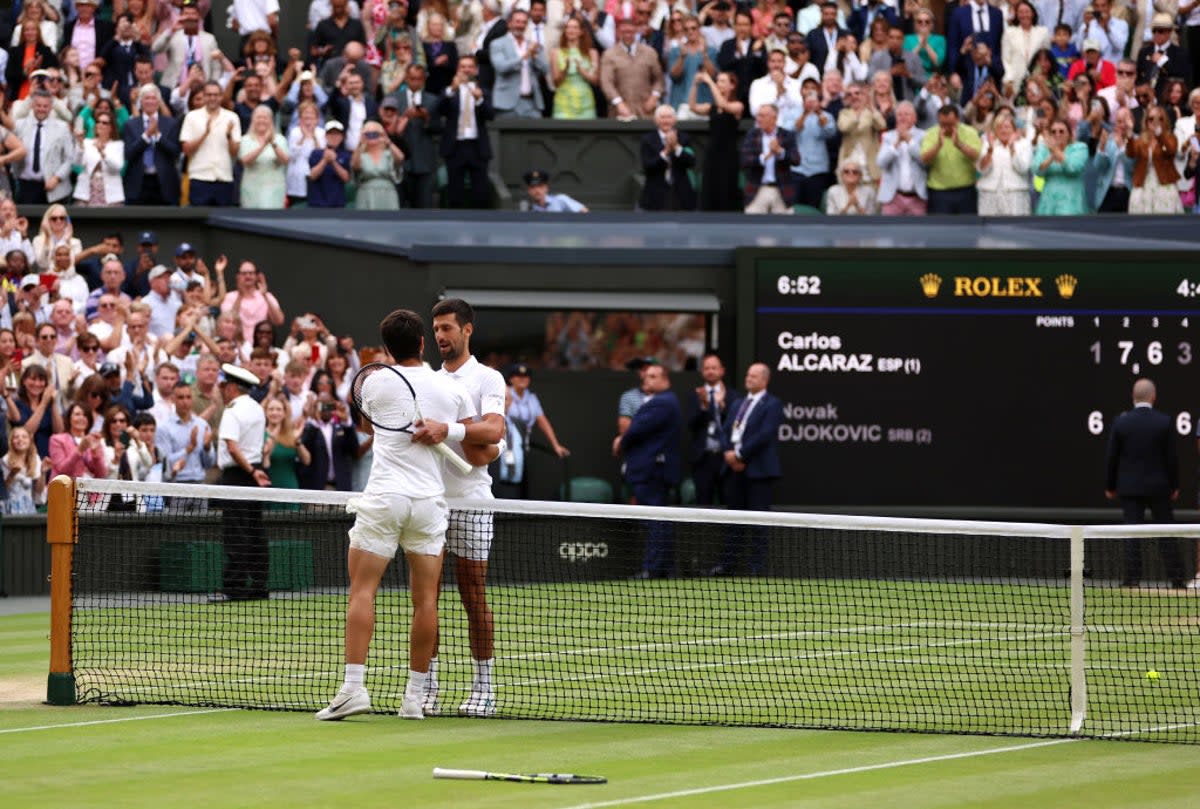 The pair embrace after their five-set thriller (Getty)