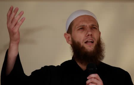 FILE PHOTO: Islamist preacher Sven Lau delivers a speech during a pro-Islam demonstration in Cologne, Germany June 9, 2012. REUTERS/Ina Fassbender/File Photo