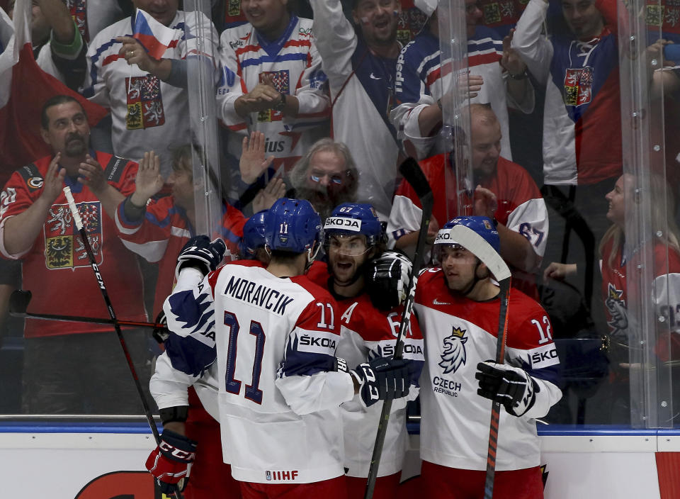 Czech Republic's players and supporters celebrate after scoring during the Ice Hockey World Championships group B match between Czech Republic and Switzerland at the Ondrej Nepela Arena in Bratislava, Slovakia, Tuesday, May 21, 2019. (AP Photo/Ronald Zak)