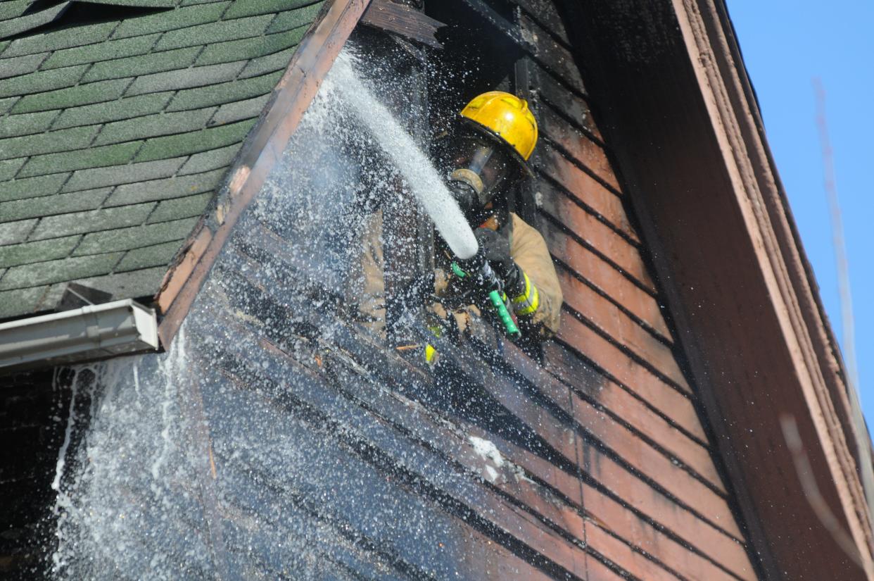 Richmond Fire Department sprays water on a hot spot Monday, March 1, 2021, at a South Ninth Street building.