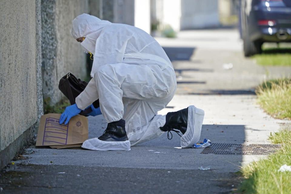 Forensic officers at the scene in the Rossfield Estate in Tallaght (Niall Carson/PA) (PA Wire)