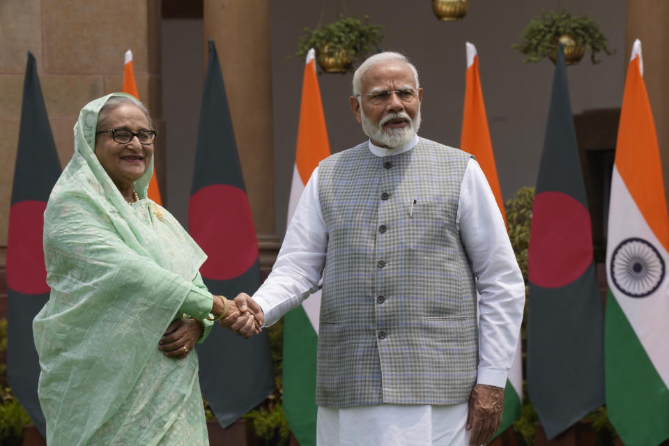 Indian Prime Minister Narendra Modi, right, shakes hand with his Bangladeshi counterpart Sheikh Hasina before their delegation level meeting, in New Delhi, India, Saturday, June 22, 2024. Hasina is on a two day state visit to India.(AP Photo/Manish Swarup)