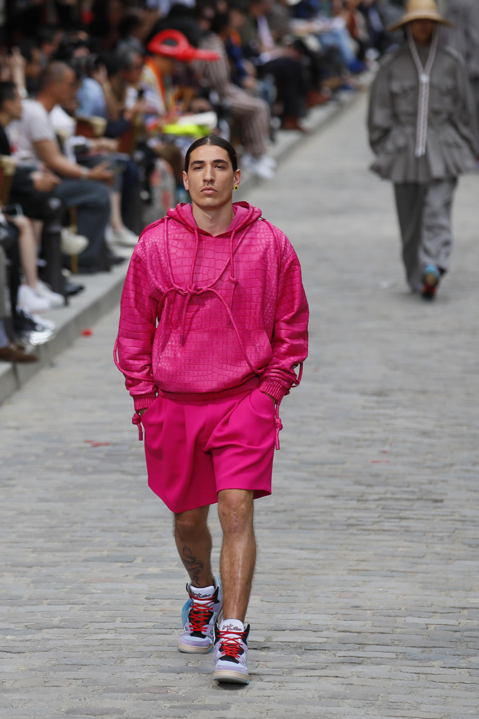 Soccer player Hector Bellerin wears a creation for the Vuitton mens Spring-Summer 2020 fashion collection presented in Paris, Thursday, June 20. (AP Photo/Francois Mori)