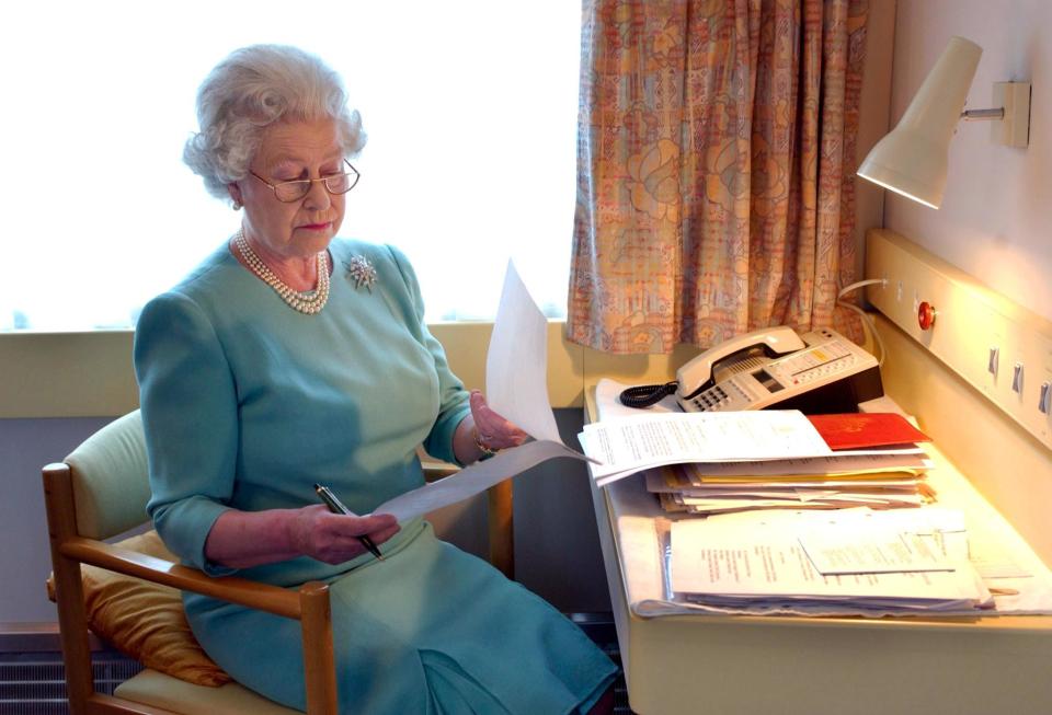 The Queen pictured in her office on the Royal Train in 2002 [Photo: Getty]