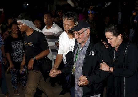 Angelita Muxfeldt (R), friend of Brazilian death row prisoner Rodrigo Gularte, supports Priest Carolus (2nd R) as they arrive at Wijayapura port after returning from the prison island of Nusakambangan in Cilacap, Central Java, Indonesia, early April 29, 2015. REUTERS/Beawiharta