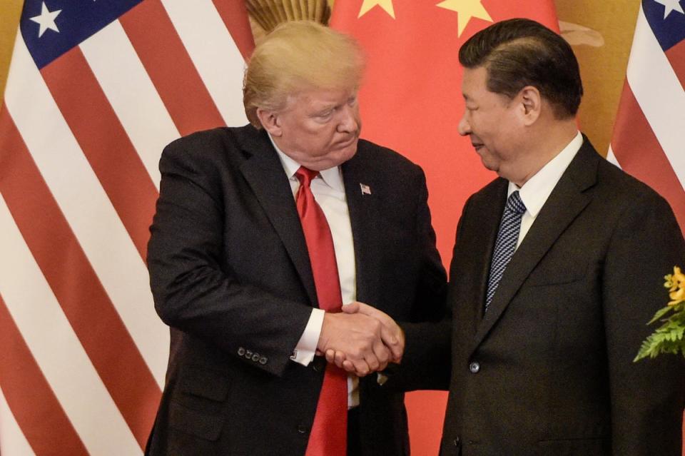 US President Donald Trump (L) shakes hand with China's President Xi Jinping at the end of a press conference at the Great Hall of the People in Beijing on November 9, 2017 (AFP via Getty Images)