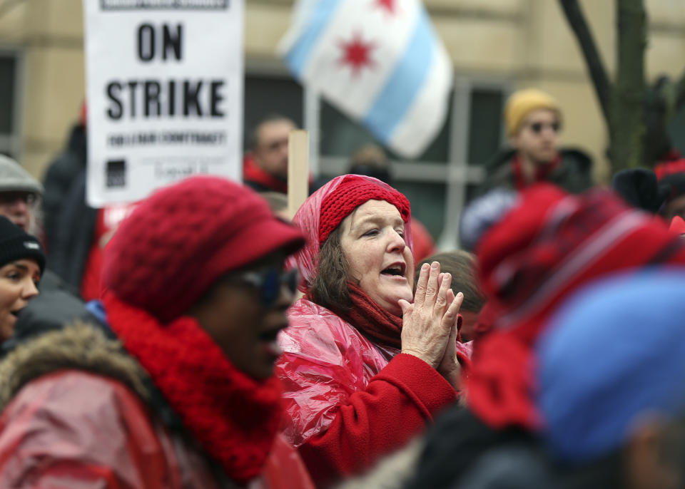 Ruth Arnold, center, a preschool special education teacher at Philip Rogers Elementary School in Chicago, rallies with other striking Chicago Teachers Union members and their supporters at Roosevelt Road and Halsted Street in Chicago on Wednesday, Oct. 30, 2019. (Terrence Antonio James/Chicago Tribune via AP)