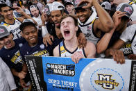 Marquette's Tyler Kolek, tournament MVP, center, celebrates with his teammates after winning their NCAA college basketball game against Xavier for the championship of the Big East men's tournament, Saturday, March 11, 2023, in New York. (AP Photo/John Minchillo)