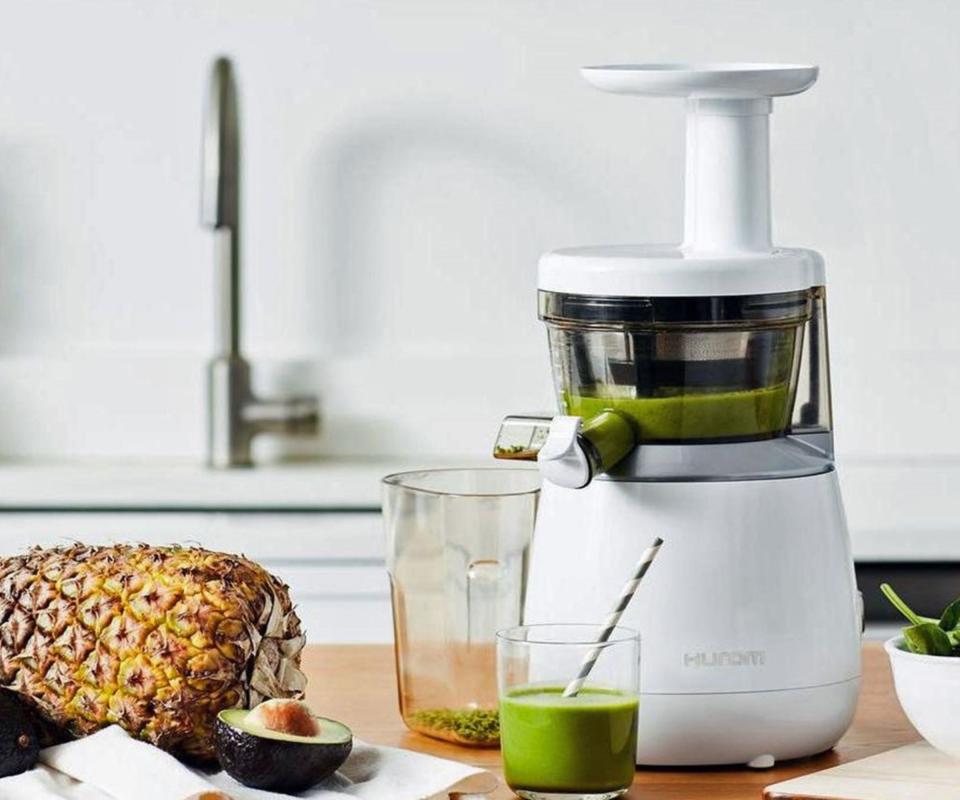 Hurom Slow Juicer on a kitchen counter.