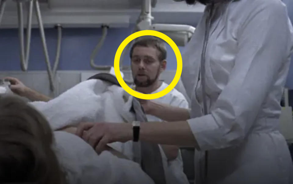 A man's face circled in a hospital scene