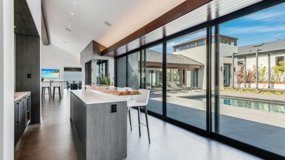 Glass-sliding doors open onto the pool deck. - Credit: Peter McMenamin