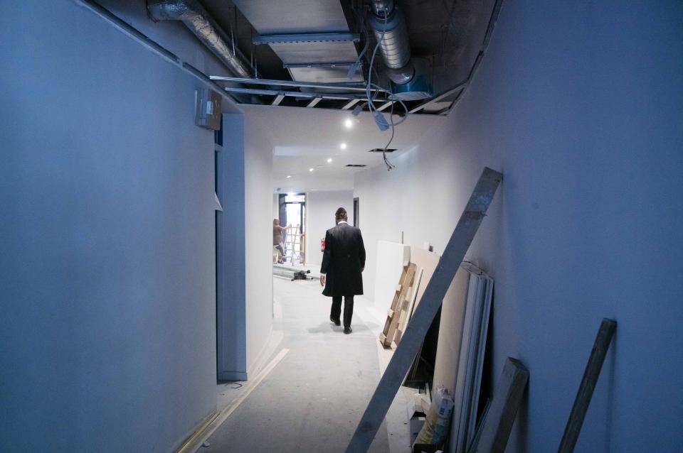 Rabbi Yehuda Teichtal walks through the construction site of the new Jewish educational and cultural complex in Berlin, Germany, Monday, June 12, 2023. The Pears Jewish Campus, run by the local Chabad community, is located in the German capital's Wilmersdorf neighbourhood and will be officially opened Sunday, June 25, 2023. (AP Photo/Markus Schreiber)