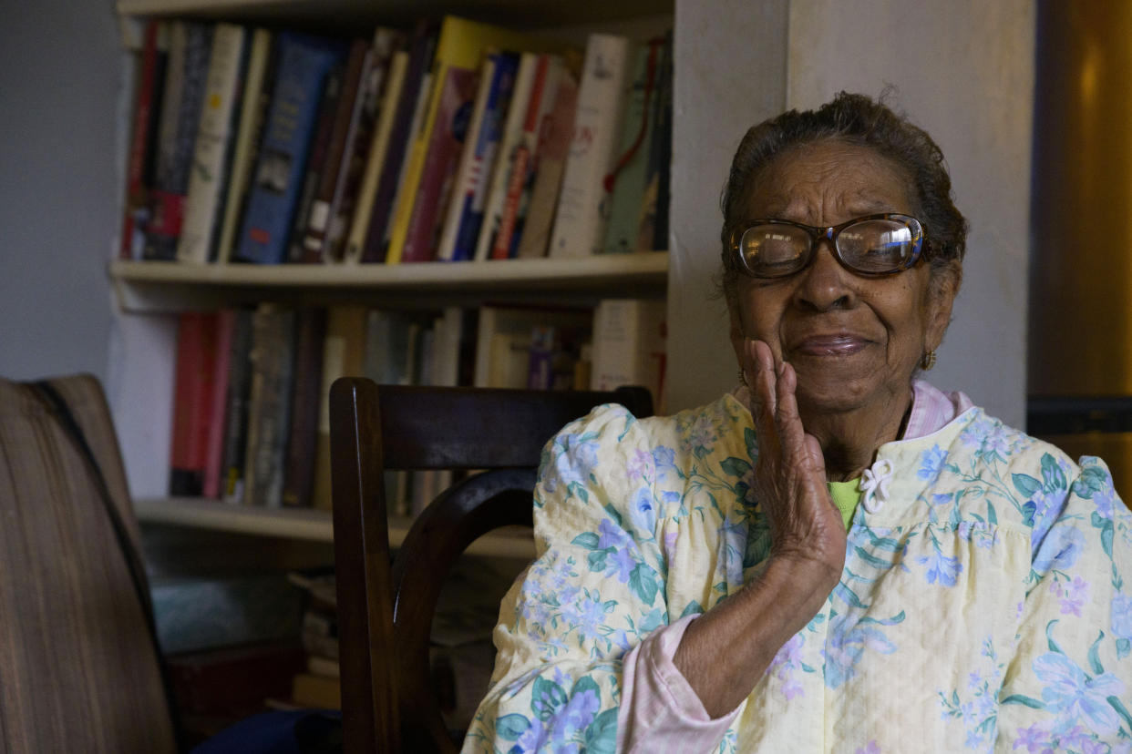 Carolyn Peters sits in her home in New Orleans, Friday, Feb. 4, 2022. Peters, who lives on a fixed retirement income and has high utility bills including late fees from Entergy, a major utility provider in Louisiana and three other Southern states, has received aid from the federal Low Income Home Energy Assistance Program. (AP Photo/Matthew Hinton)