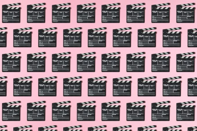 Wooden old movie clapperboard pattern with hard shadow on pink background. Concept of film industry, cinema, entertainment, and Hollywood.