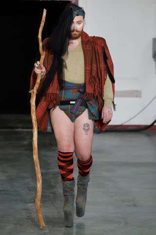 <p>GEOFFROY VAN DER HASSELT/AFP via Getty </p> Sam Smith models a look in the Vivienne Westwood show at Paris Fashion Week on March 2, 2024