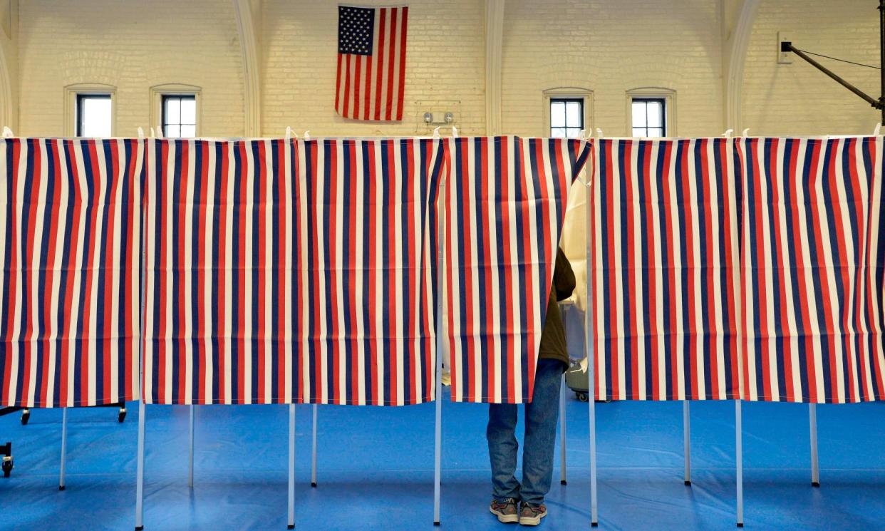 <span>A person votes in Concord, New Hampshire, in 2020.</span><span>Photograph: Joseph Prezioso/AFP/Getty Images</span>