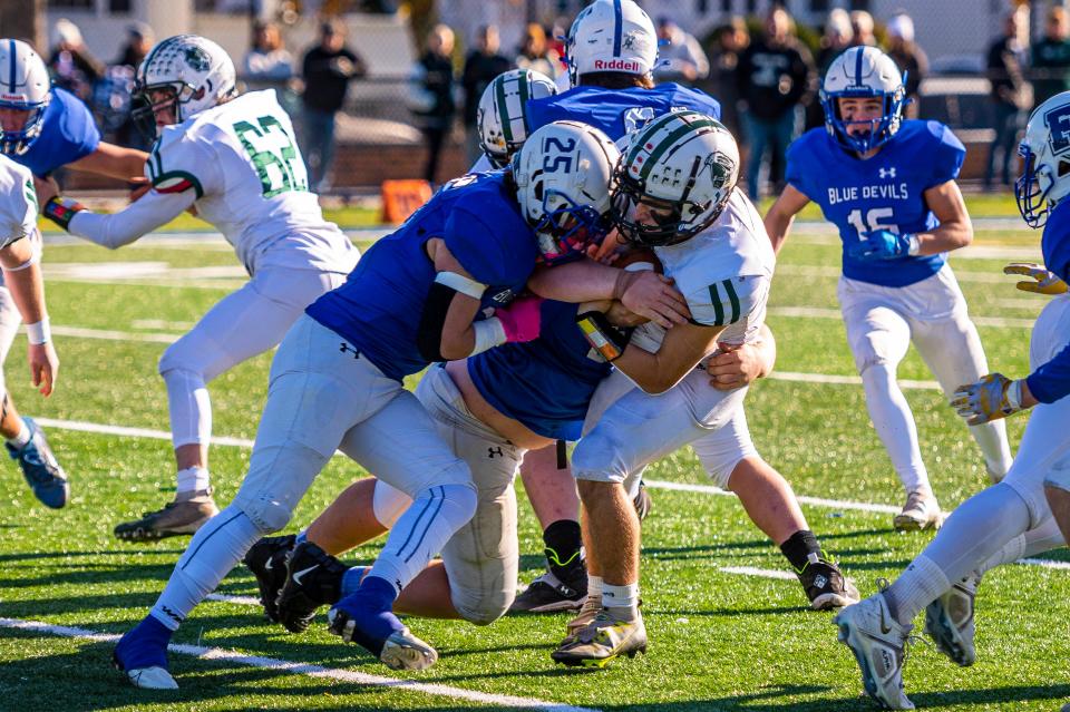 Fairhaven's Justin Marques makes the tackle on Dartmouth's Ray Gramlich in the 2022 Thanksgiving Day game.