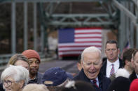 President Joe Biden greets people after speaking during a visit to the NH 175 bridge over the Pemigewasset River to promote infrastructure spending Tuesday, Nov. 16, 2021, in Woodstock, N.H. (AP Photo/Evan Vucci)