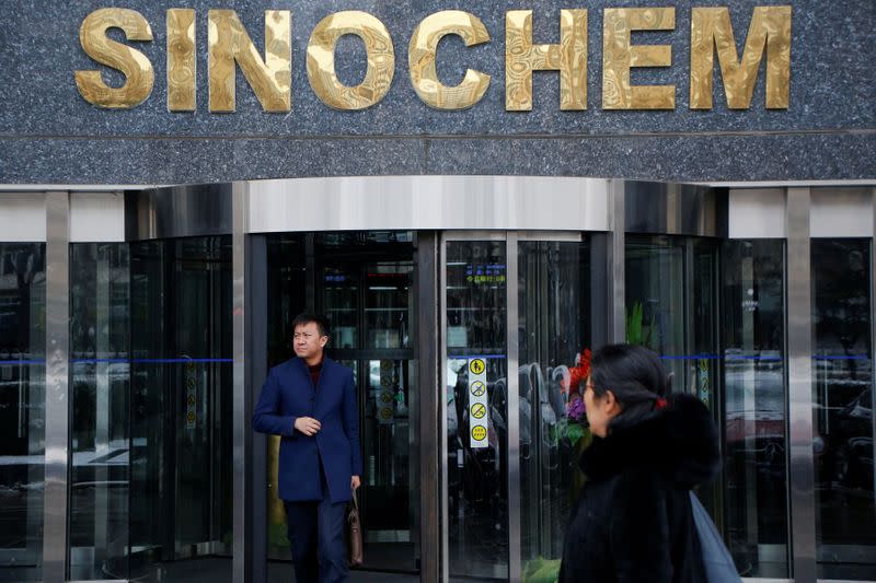 FILE PHOTO: A man walks out of a Sinochem office building in Beijing