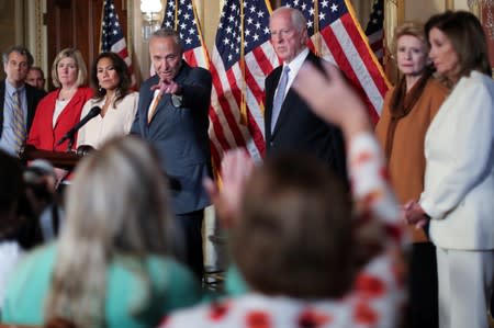 FILE PHOTO - U.S. House Speaker Pelosi and Senate Minority Leader Schumer lead a news conference to demand that the U.S. Senate vote on gun background check legislation at the U.S. Capitol in Washington