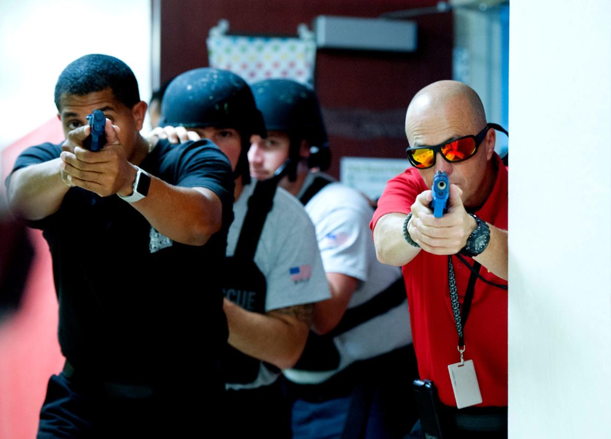 Members of Palm Beach Police and Palm Beach Fire Rescue participate in active shooter training at Palm Beach Public in July 2018. Trainings are conducted regularly at schools and religious institutions throughout the town.