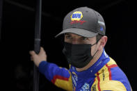 Alexander Rossi watches from his pit box during testing at the Indianapolis Motor Speedway, Thursday, April 8, 2021, in Indianapolis. (AP Photo/Darron Cummings)