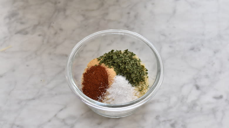 Breadcrumbs and seasonings in a bowl