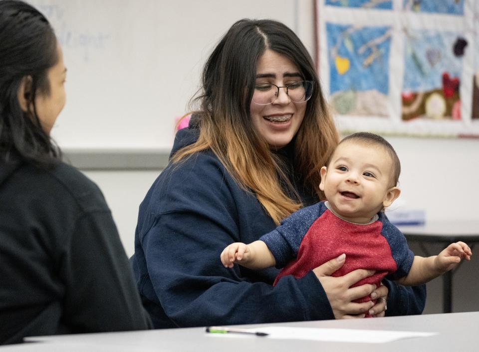 Valerie Lara, 18, plays with her 6 month old son, Isaac, during a parenting class at Marcos de Niza High School. The high school offers Teenage Pregnancy Program (TAPP) to help pregnant and parenting teens finish high school.