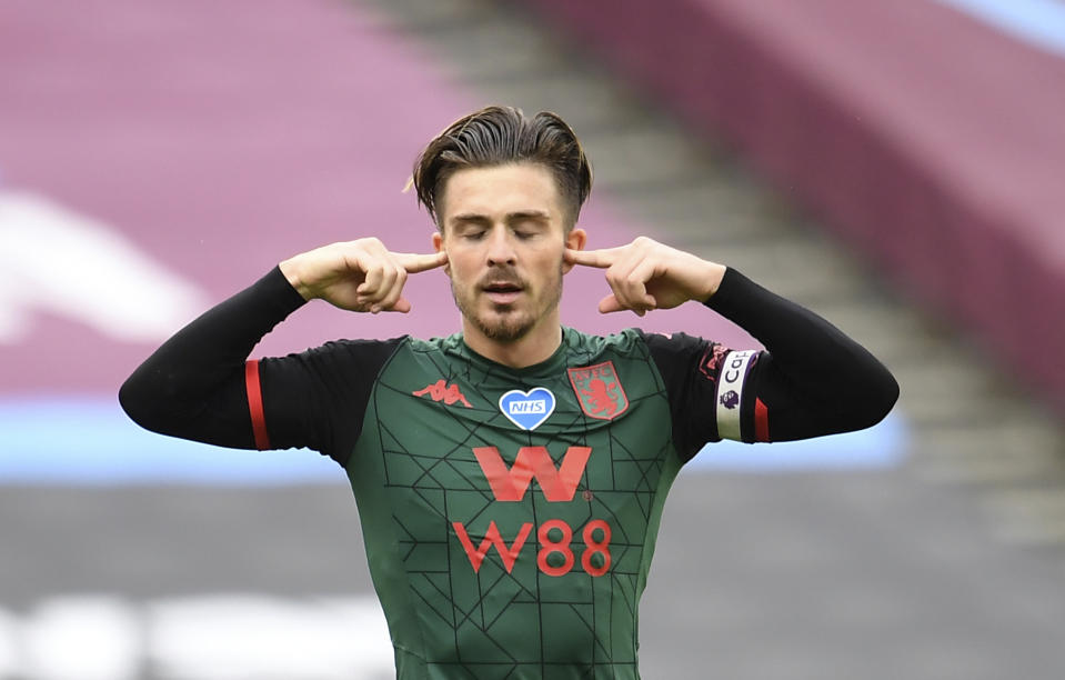 Aston Villa's Jack Grealish, celebrates after scoring the opening gosl of the game during the English Premier League soccer match between West Ham United and Aston Villa at the London Stadium in London, Sunday, July 26, 2020. (Andy Rain/Pool via AP)