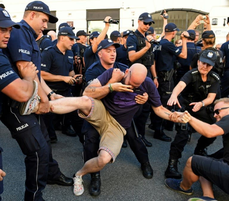 Warsaw police dragged some protesters staging a counter-demo against a far-right group across the pavement