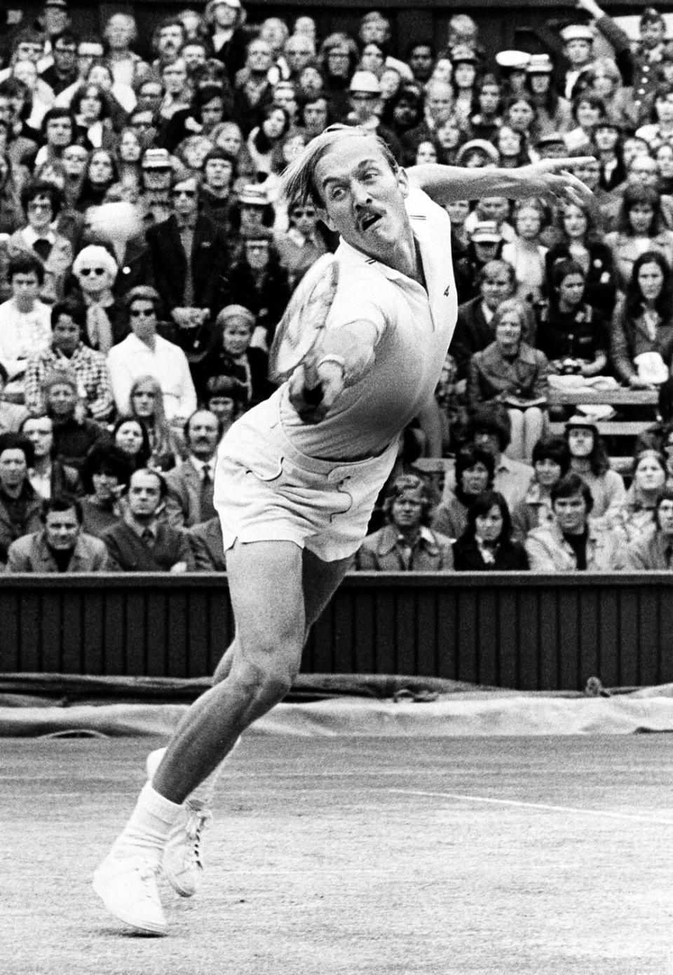 Stan Smith of the United States returns the ball to Ilie Nastase of Romania during a Wimbledon match in 1972.
