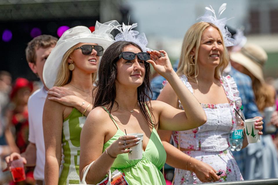 Ciara Murphy of Chicago lifed her glasses to watch a race in the infield at the 150th Kentucky Derby at Churchill Downs in Louisville, Ky., on Saturday, May 4, 2024.