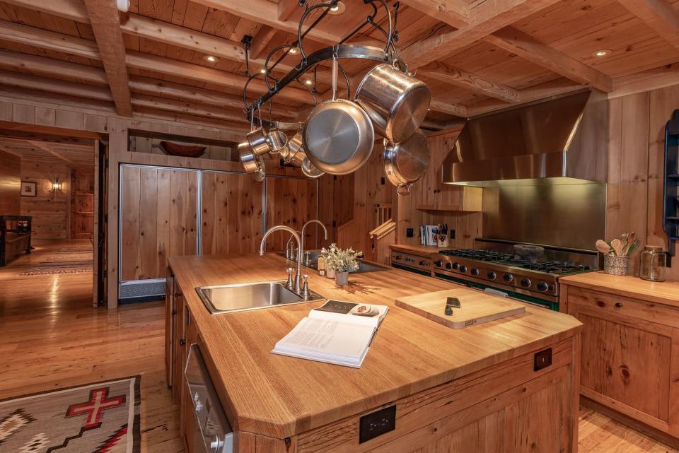 8) The wood-clad eat-in kitchen blends in seamlessly with the rest of the home.