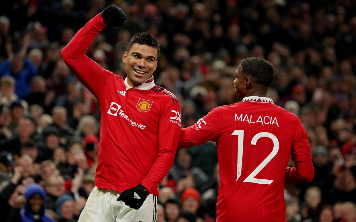 Manchester United's Casemiro celebrates scoring their first goal with Tyrell Malacia - REUTERS/Phil Noble