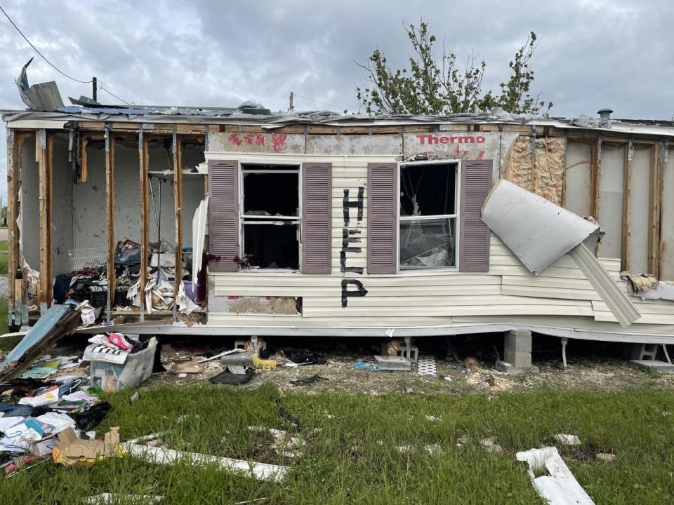 A mobile home damaged by Hurricane Ida is shown Sept. 29, 2021, in Golden Meadow, exactly a month after the Category 4 storm hit.