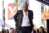 FILE - In this Oct. 16, 2018 file photo, British business magnate Richard Branson appears at a ceremony honoring him with a star on the Hollywood Walk of Fame, in Los Angeles. Branson said on Monday, Feb. 18, 2019, that he hopes that the concert that he is throwing for a humanitarian aid effort for Venezuela helps saves lives by raising funds for “much-needed medical help.” (Photo by Chris Pizzello/Invision/AP File)